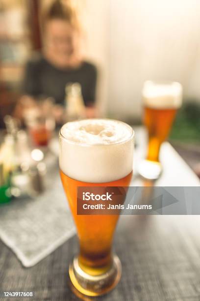 Glass Of Beer With Large White Foam In A Pub Stock Photo - Download Image Now - Beer Tap, Ale, Blond Hair