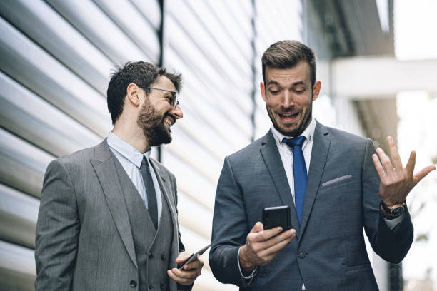istock Businessman in awe while walking with his colleague 1243929466