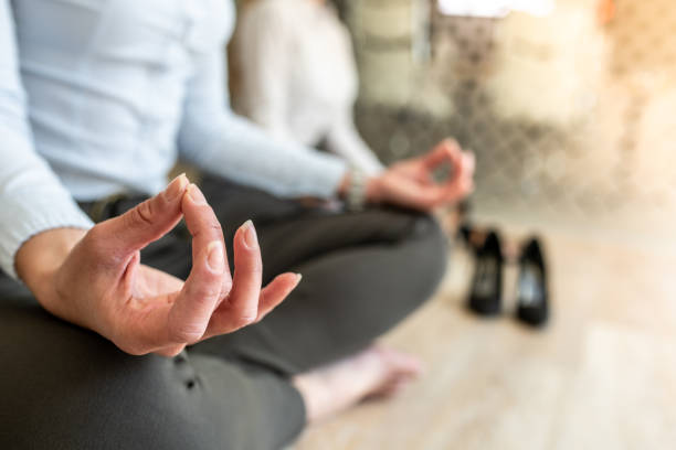 istock Colleagues sit and meditate after hard working hours 1243930767