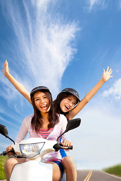 istock girls having summer trip on a scooter 124393131