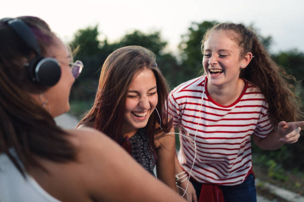 istock Three gorgeous girls laughing on a summer day 1243943322