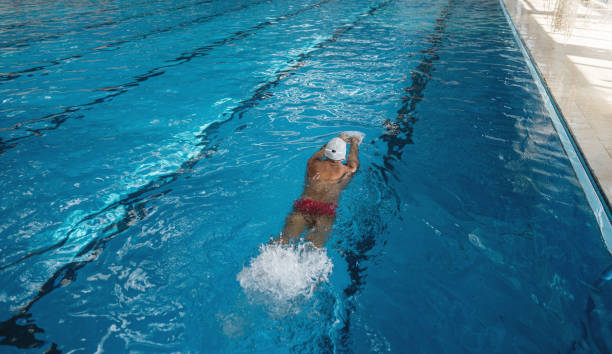 istock Man doing leg swimming exercises 1243950222