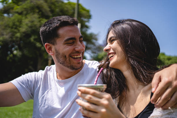 istock Couple looking at each-other face to face while relaxing with tea 1243951185