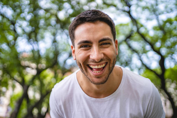 istock Macho hispanic man laughing at the camera 1243951323
