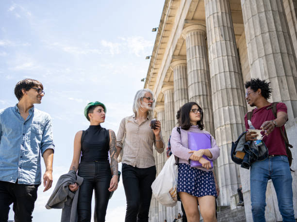 istock Professor hanging out with his students after class 1243953033