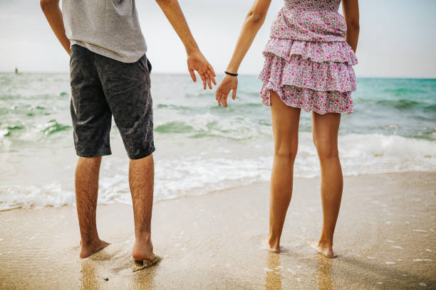 istock Happy young couple on the beach 1243960787