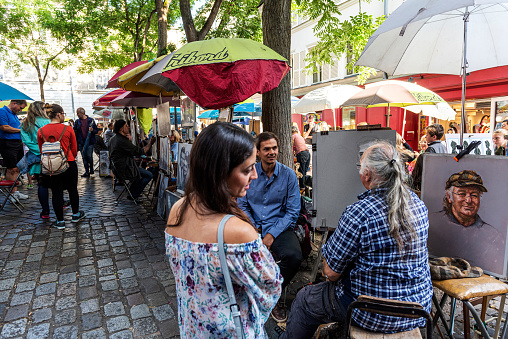 Paris, France - Jul 6, 2016: Place du Tertre in Montmartre with street artists ready to paint tourists.
