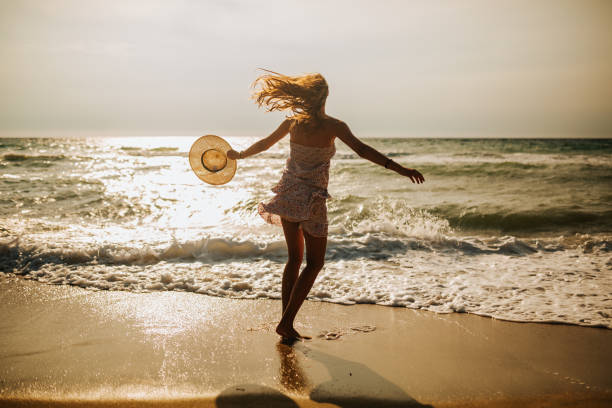 istock Enjoying windy day on the beach 1243965532