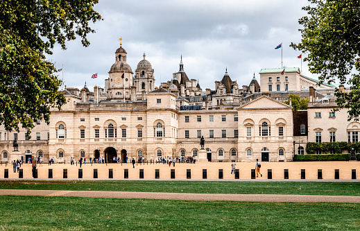London / UK - September 20, 2018: The Horse Guards Parade with tourists and various government buildings, including the Household Cavalry Museum. View from Horse Guards Road.