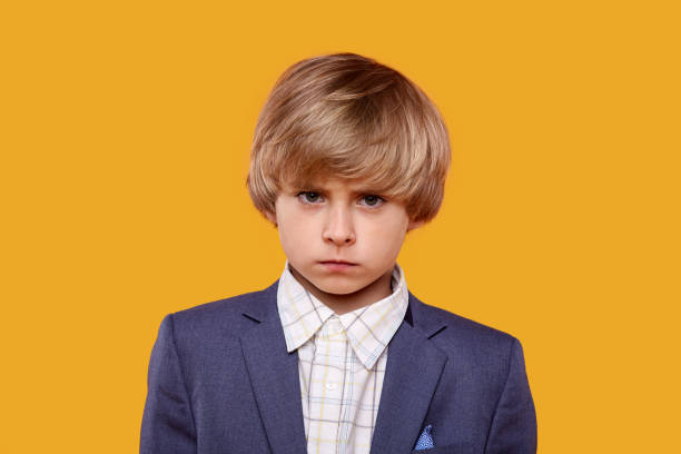 istock The dear offended boy lowered his head and puffed out cheeks 1244079130