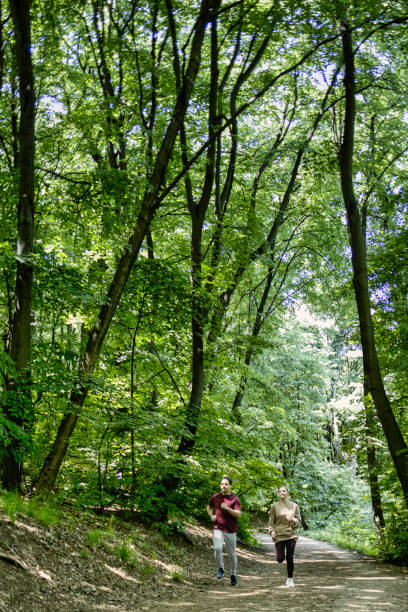 istock Healthy couple jogging in nature 1244089905