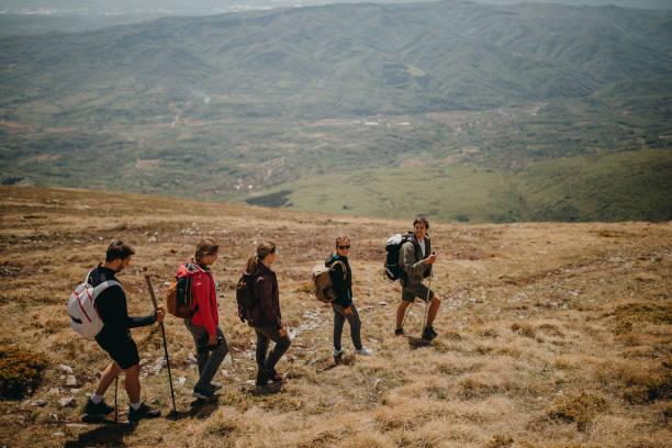 istock Friends walking over the mauntain 1244090740