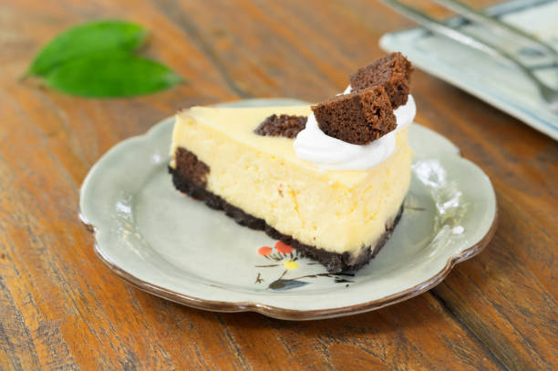 istock Cheese cake with chocolate and cream on top. 1244090910