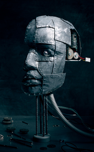Repairing rustic metal robot head.