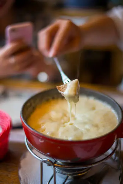 Swiss cheese fondue on dining table