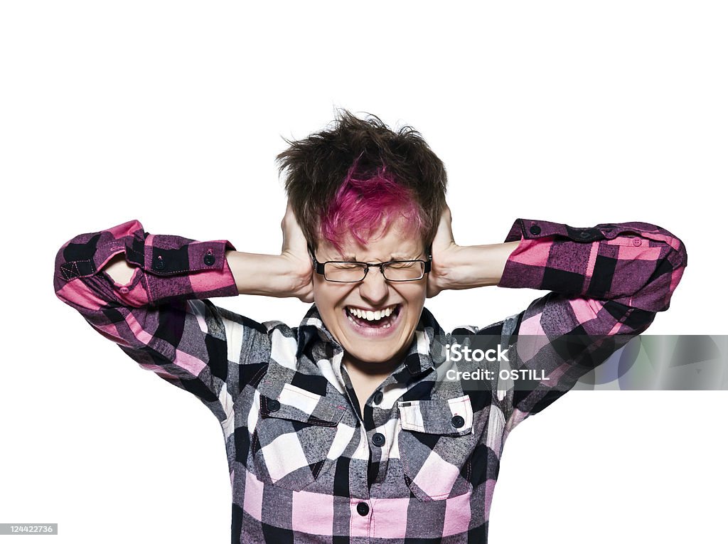 Noise and stress concept - woman covering her ears Portrait of a cool young woman screaming while covering ears isolated on white background Adult Stock Photo