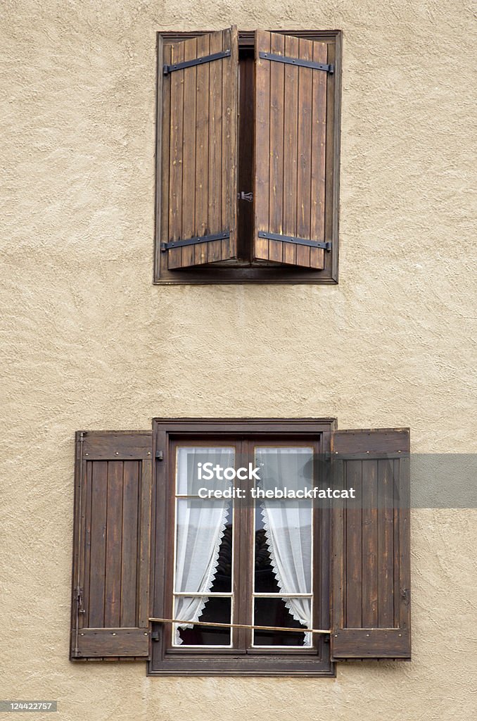 two windows A detail of a home: two windows, one is closed and the other one is open Architecture Stock Photo