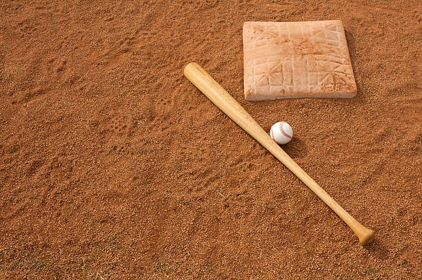 istock Baseball & Bat on the Infield 124427720