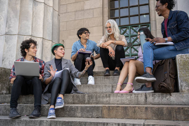 istock Professor hanging out with his students during a break 1244283164