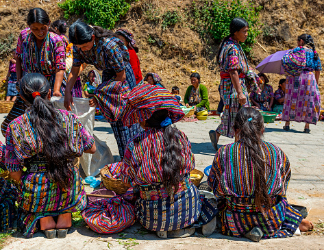 Guatemalan Mayan indigenous women in traditional clothing selling their products on the local market of Solola near Panajachel and the Atitlan Lake.