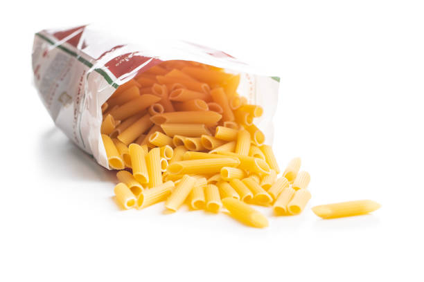istock Uncooked penne pasta. Dried italian pasta isolated on white background. 1244319117