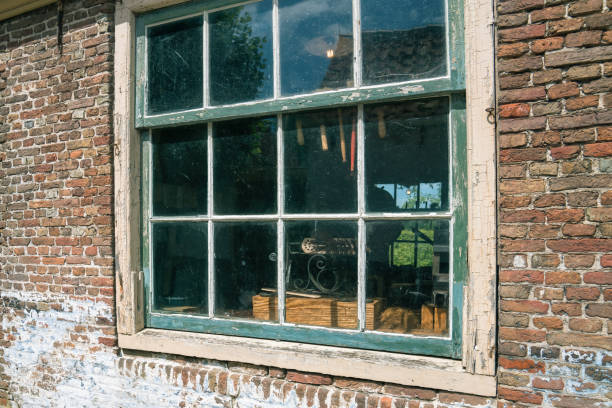 A look through the old window of a brush maker