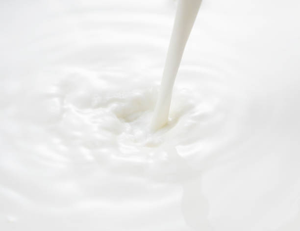 istock milk pouring place. Waves and Splashes. 1244331540