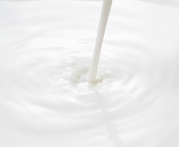 istock milk pouring place. Waves and Splashes. 1244332097