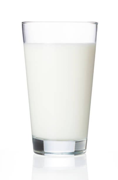 istock Milk in a glass placed on a white background 1244351516