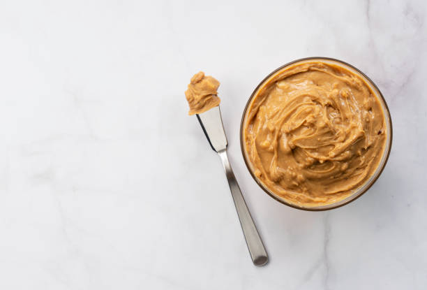 istock peanut butter on the background of the stone with copy space 1244351730