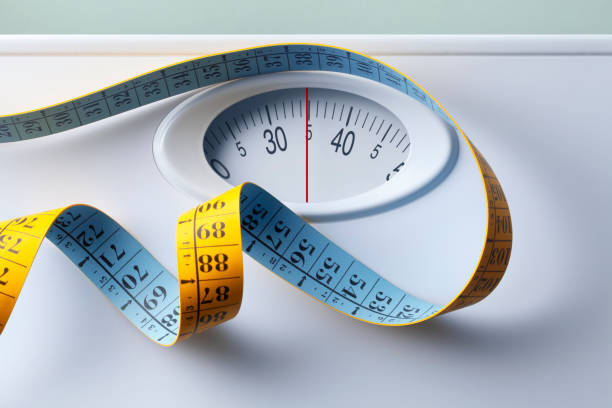istock Bathroom scale with tape measure 1244354865