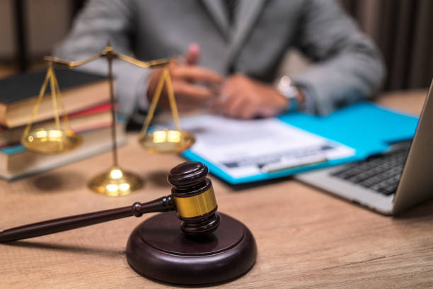 istock Lawyer business working on wooden table at office. 1244357971