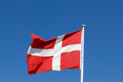 The Danish flag, called Dannebrog, blowing in the wind, Copenhagen, Denmark.