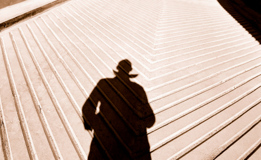 Male shadow on urban concrete. 