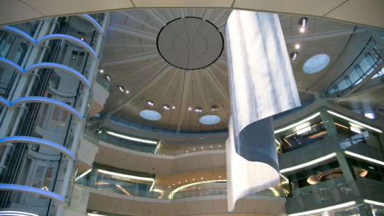 abstract futuristic public hall interior, view from below to spherical roof