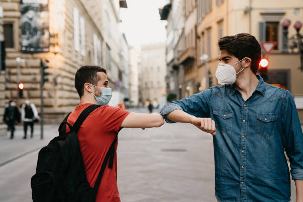 istock Two friends greeting each other with the elbow 1244402498