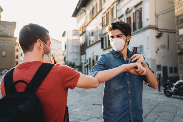istock Two friends greeting each other with the elbow 1244402539