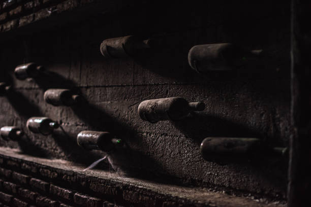 istock Old, ancient wine collection and dusty wine bottles in an underground cellar 1244407251