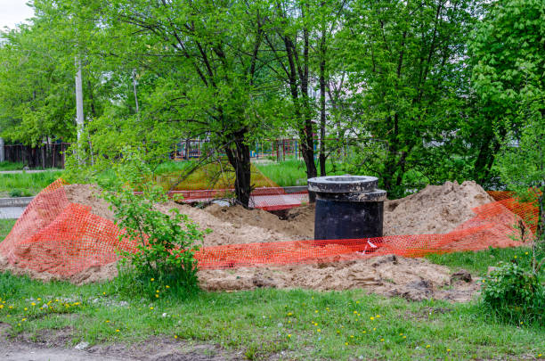 istock Fenced trench in sandy soil with concrete rings 1244412521