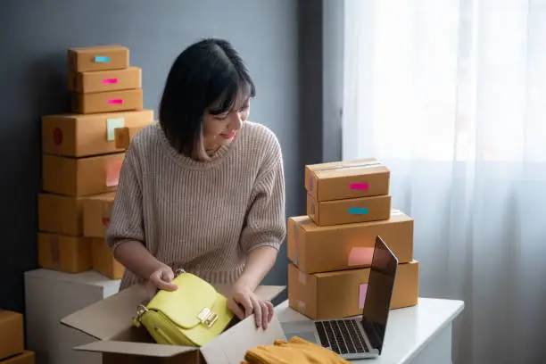 Photo of Young asian girl is freelancer with her private business at home