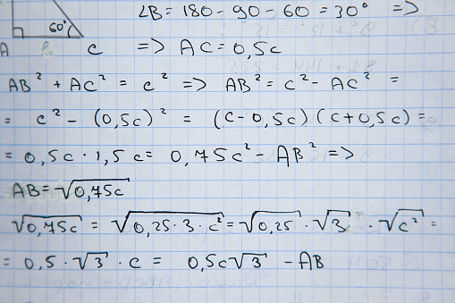 Opened notebook with some exercices, equations, close up