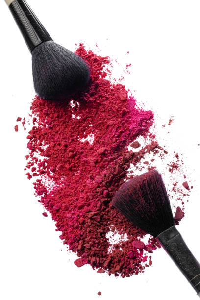 istock Crushed eyeshadows with brush isolated on white background. 1244441856