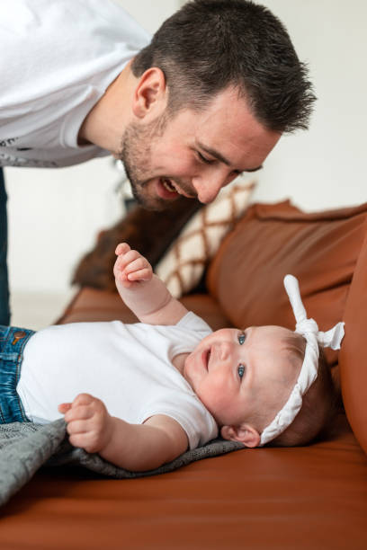 istock Beautiful girl lying on her lovingly looking at her attractive father 1244443502