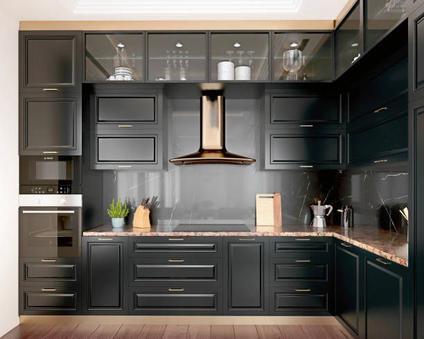 Modern interior design kitchen with black marble, black cabinets, dark gold trim and granite countertop, 3d render, 3d illustration stock photo