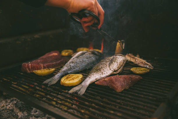 istock cooking fish and potatoes on grill 1244473430
