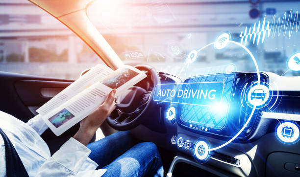 young woman reading a magazine in a autonomous car. driverless car. self-driving vehicle. heads up display. automotive technology. young woman reading a magazine in a autonomous car. driverless car. self-driving vehicle. heads up display. automotive technology. runaway vehicle stock pictures, royalty-free photos & images