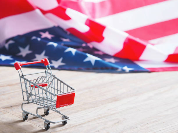 istock red shopping cart on wooden table 1244491088