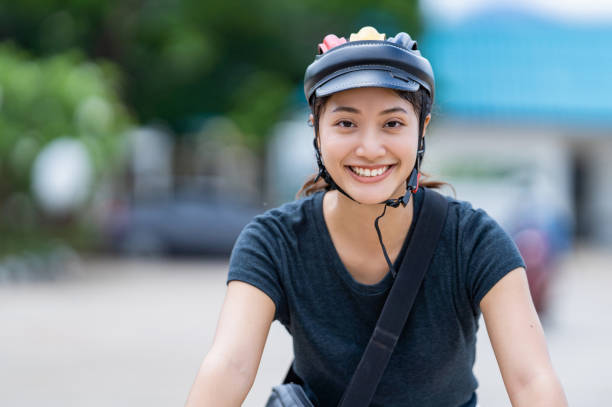 istock Asian women ride bicycles to work. 1244495039