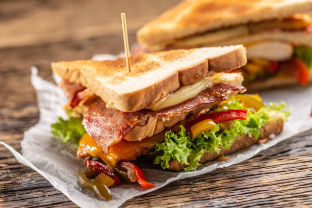 istock Club sandwich on a rustic table witch chicken, bacon, pepper and lettuce. 1244496679