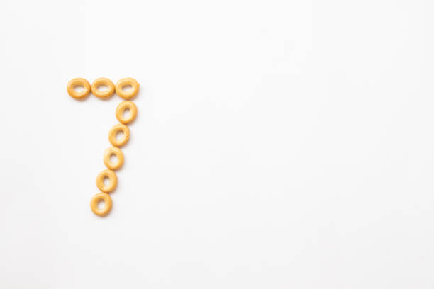 istock number 7 made from cookies on a white background with space for text. layout for school or diet 1244497279
